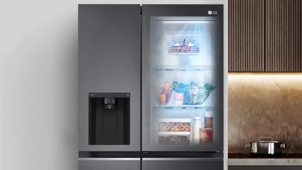 fridge beside wooden cabinet and silver pot